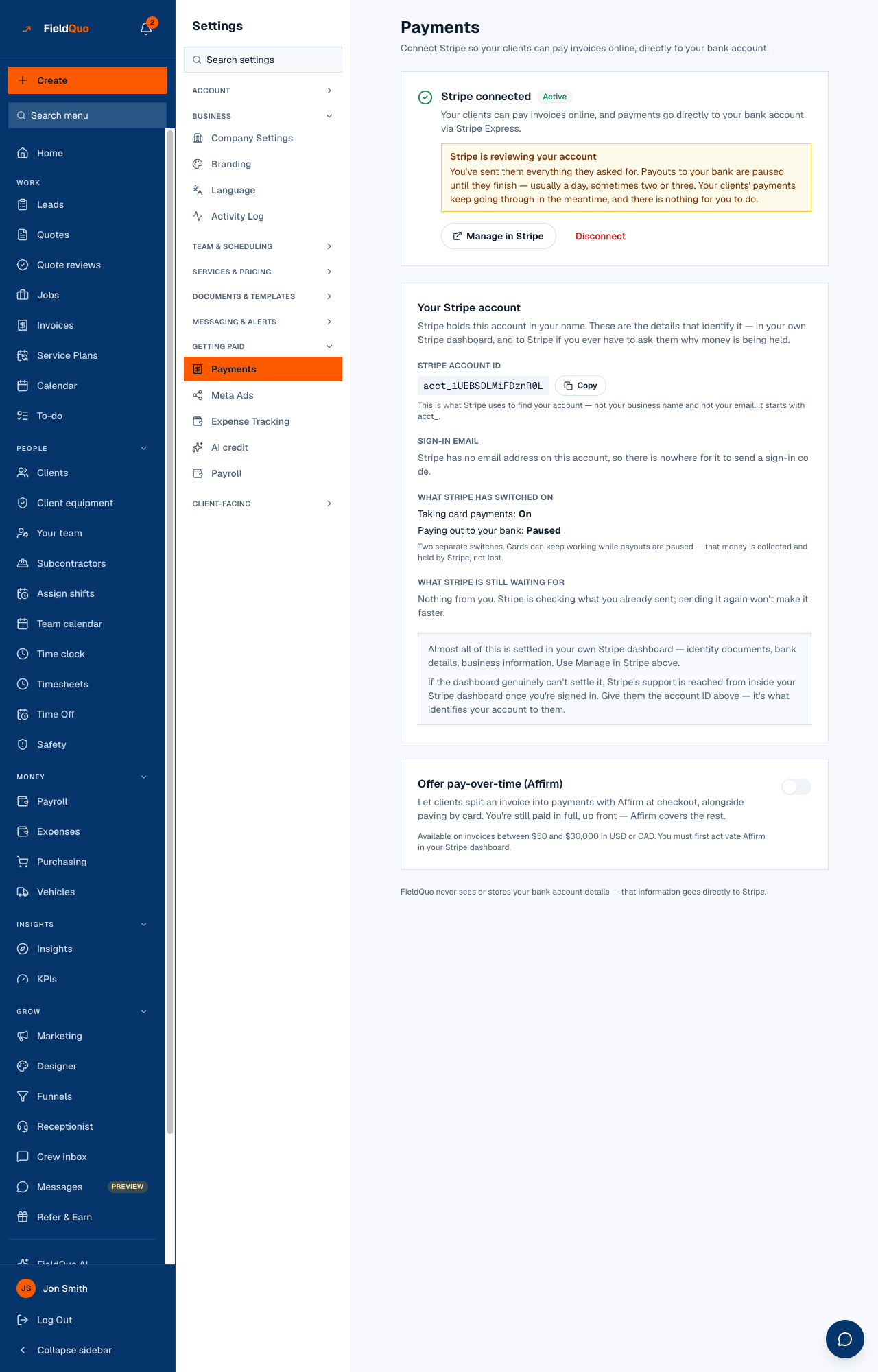Settings → Payments with payouts paused — the amber “Stripe is reviewing your account” notice, payouts Paused, and “What Stripe is still waiting for: Nothing from you.”
